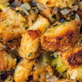 Up close image of the top of homemade stuffing in a casserole dish.