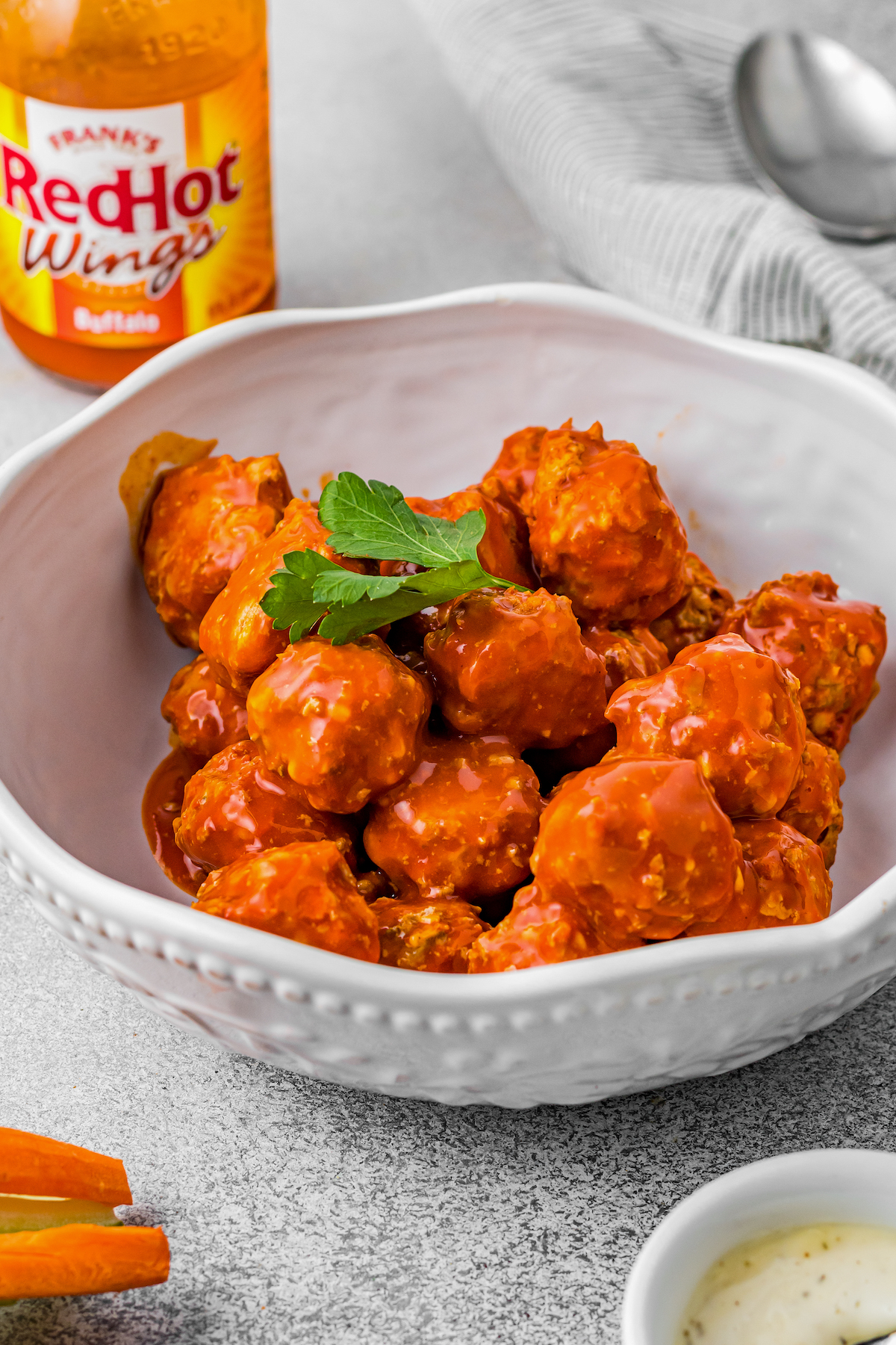 Slow-cooked buffalo meatballs in a serving bowl.
