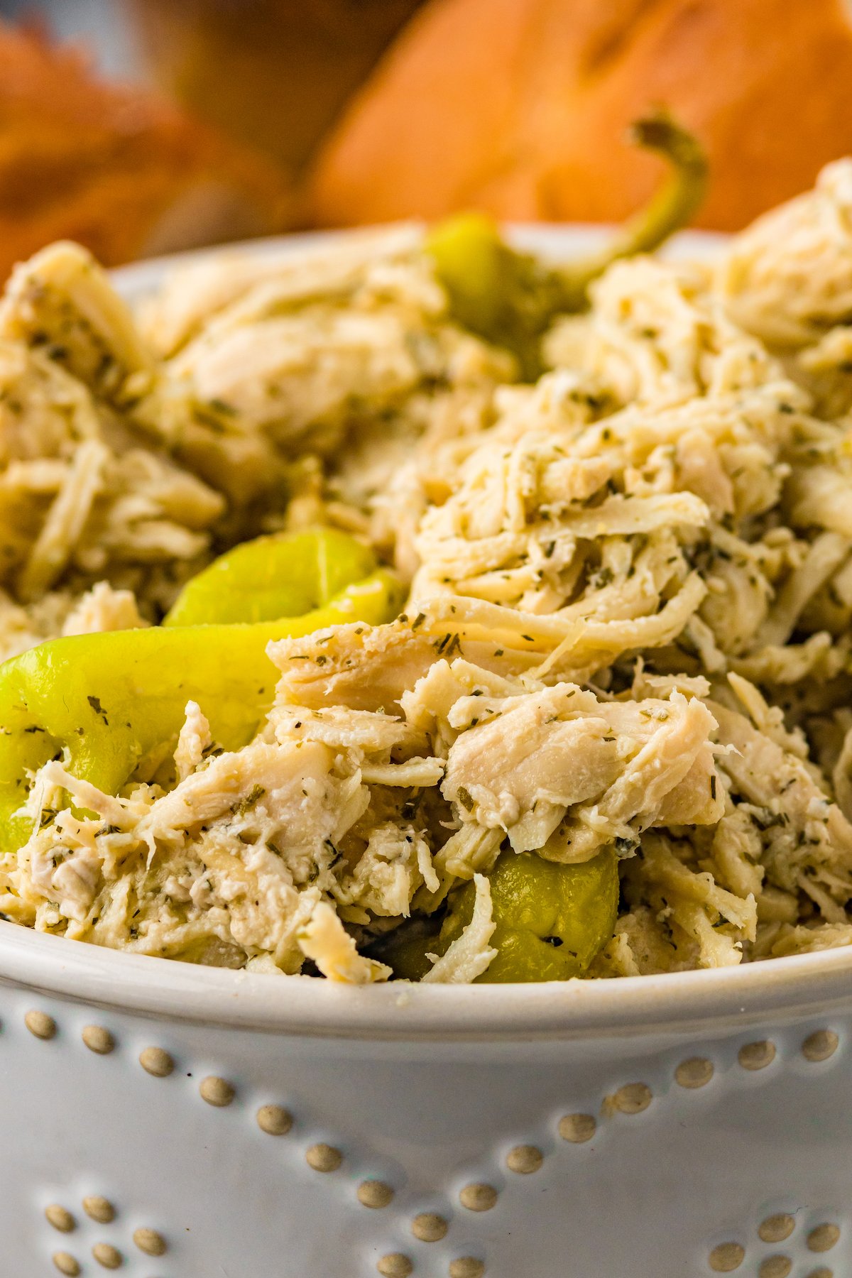 A serving bowl of shredded Mississippi chicken.