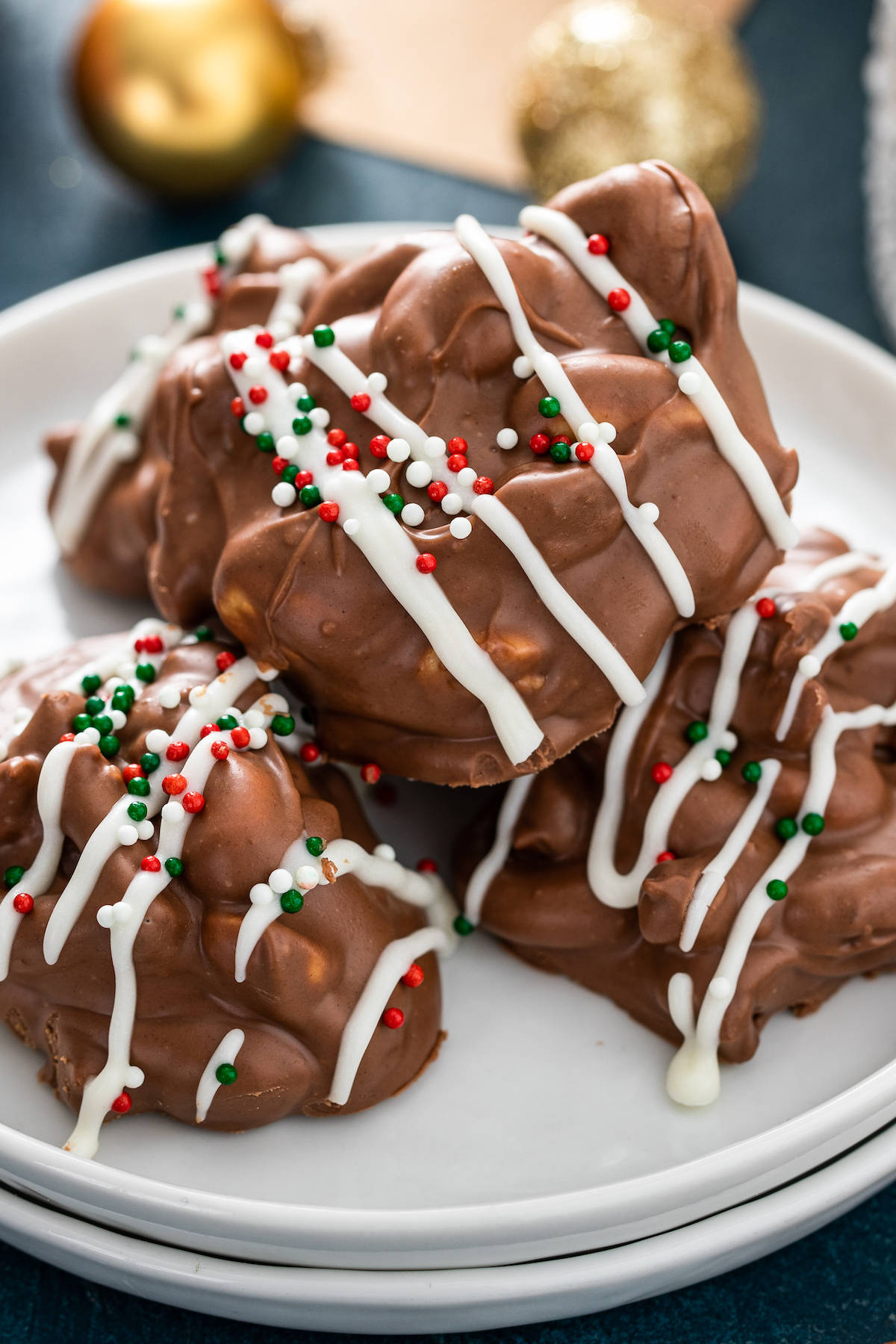 Candy clusters stacked on a white plate.