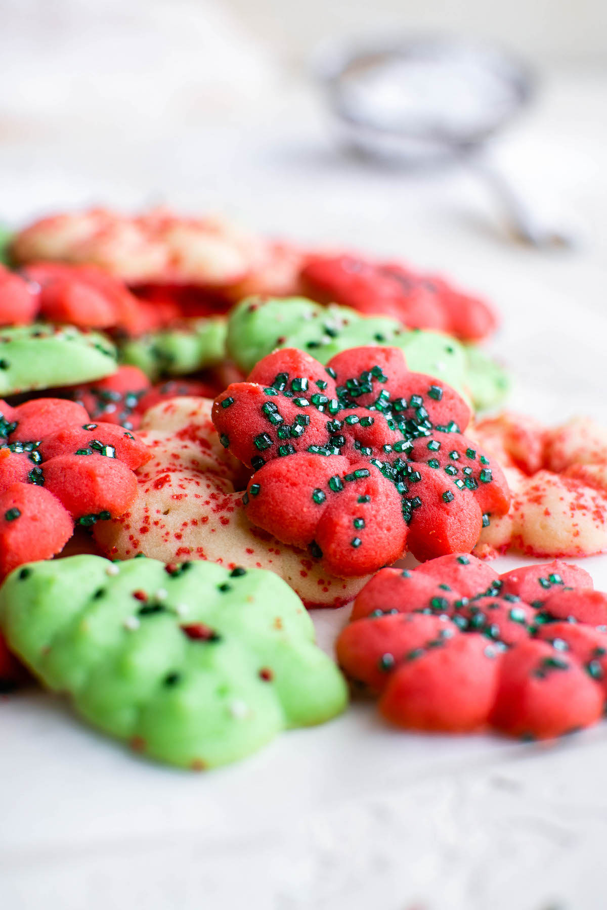 Spritz cookies arranged on a counter top.