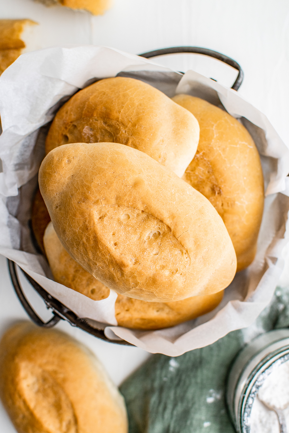 A bowl of oval-shaped rolls.