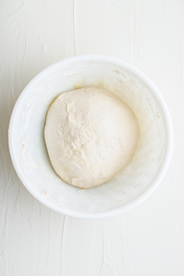 A smooth ball of dough in a bowl.