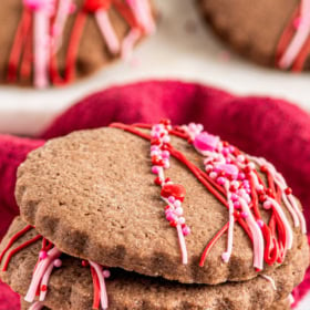 Chocolate sugar cookies stacked on top of each other.