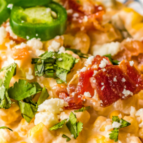 Up close image of crockpot corn dip with jalapenos and bacon.