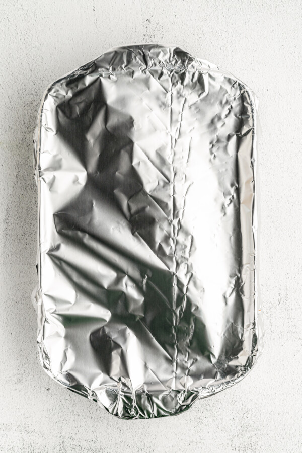 A baking dish covered with foil.
