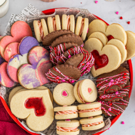 Valentine's Day Cookies in a red cookie tin with a red napkin.