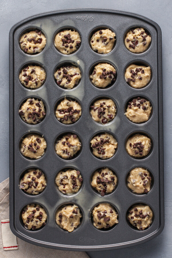 Unbaked mini muffins, topped with extra chocolate chips.