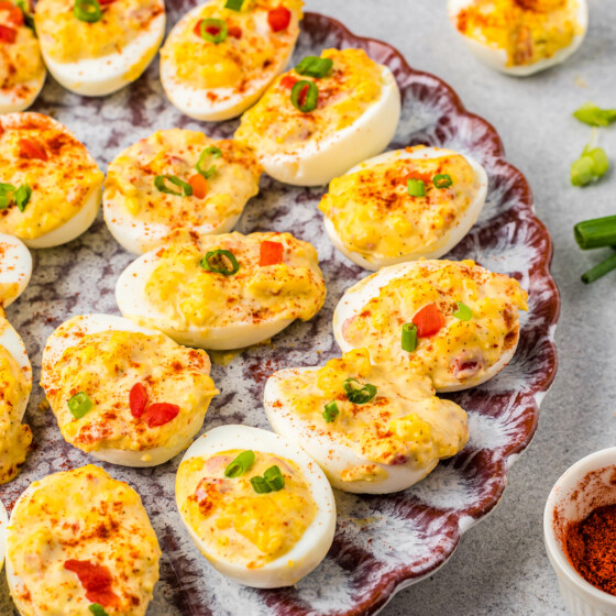 A serving platted filled with homemade deviled eggs
