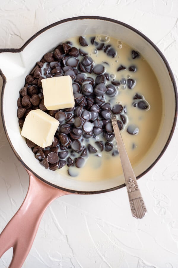 Chocolate chips, condensed milk, and butter in a saucepan.