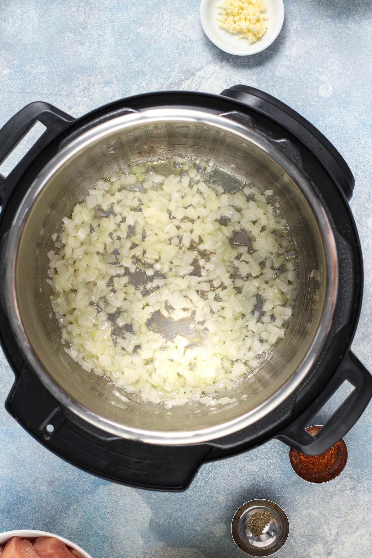 Onions and garlic in an Instant Pot.