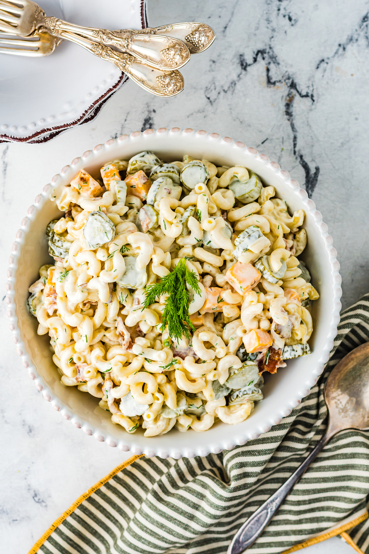 Pasta salad garnished with fresh dill.
