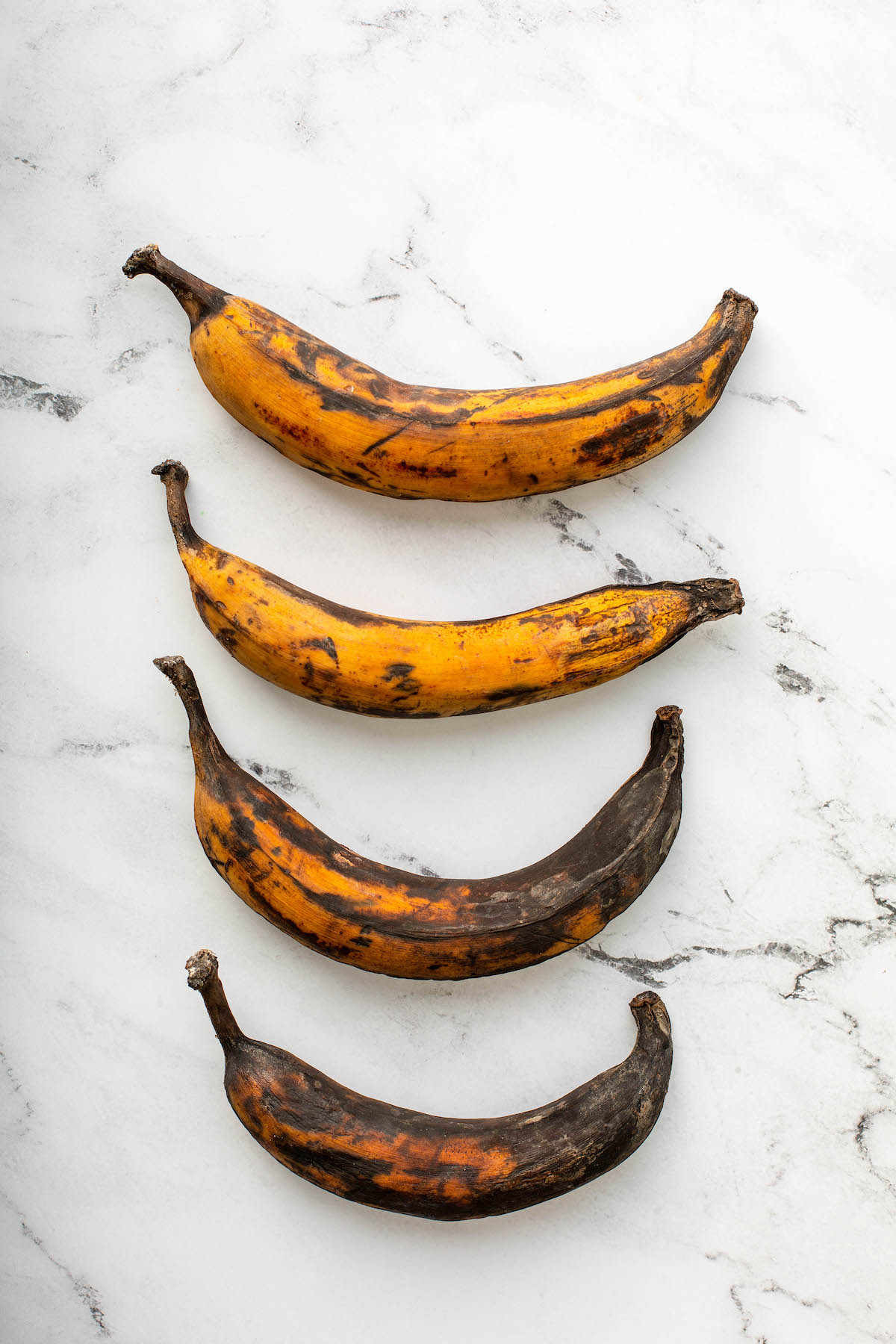 Plantains in varying degrees of ripeness.