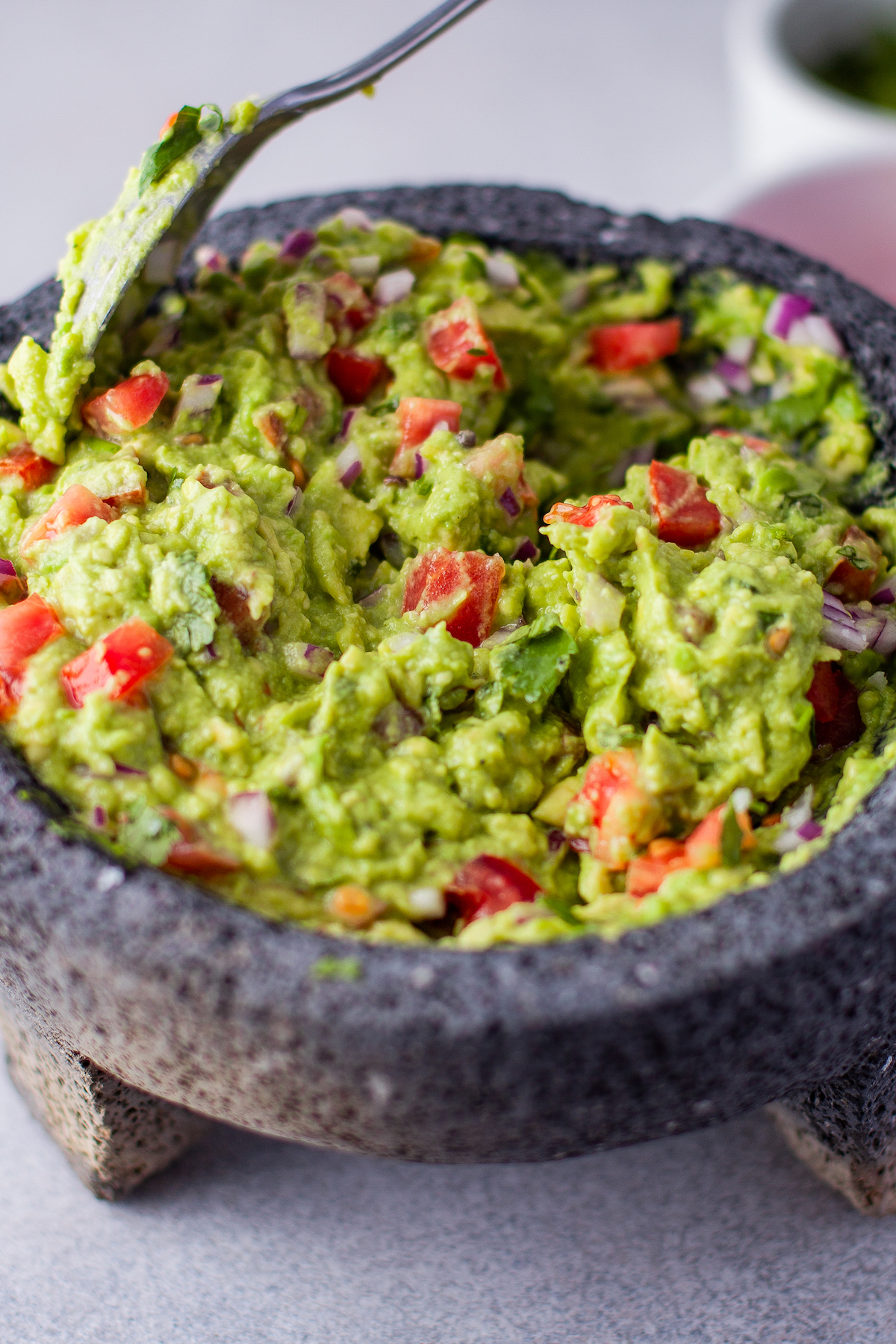 Authentic guacamole made with fresh avocados, tomatoes, and more.
