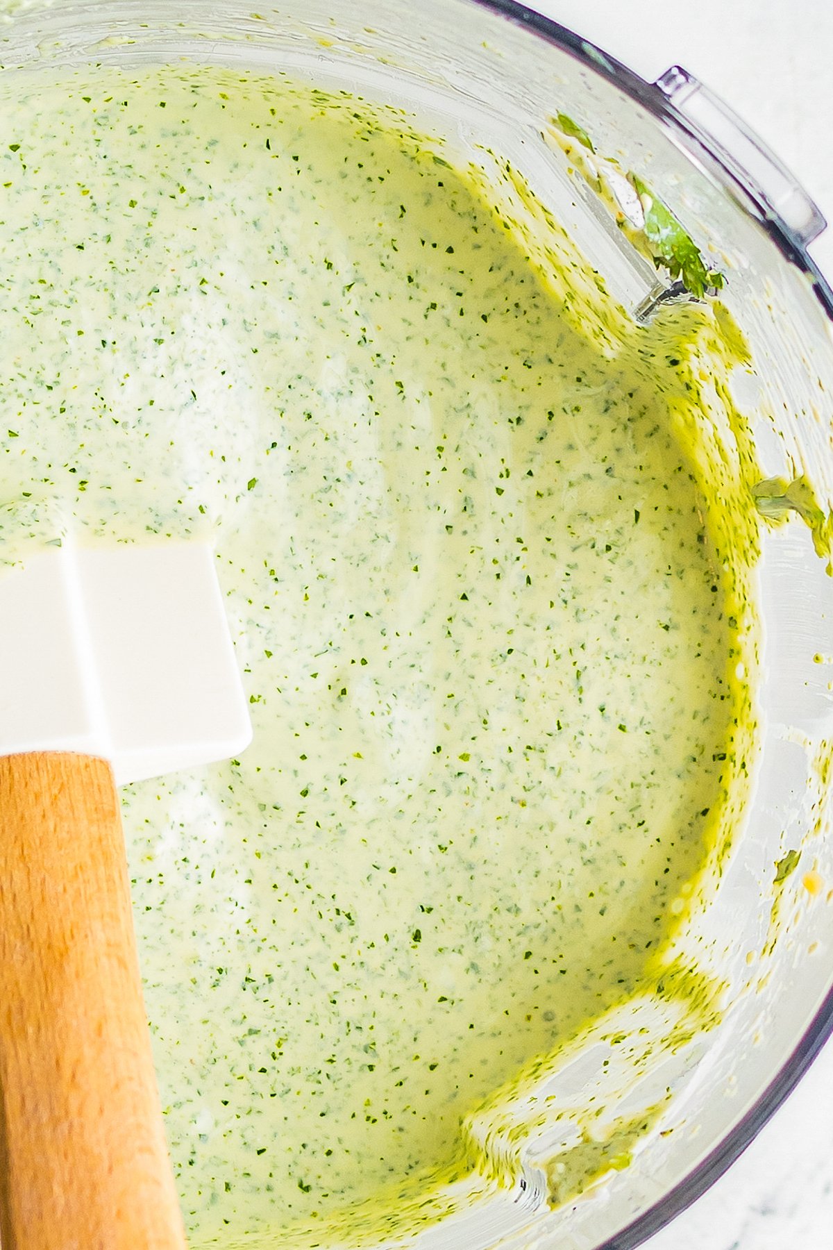 Close-up shot of creamy cilantro lime dressing, to show the texture and color in detail.