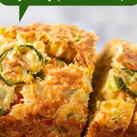 Slices of jalapeno cheddar quick bread on a cutting board.