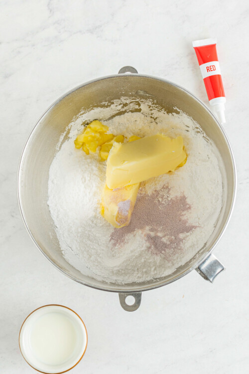 Butter and sugar are combined in the bowl of a stand mixer.