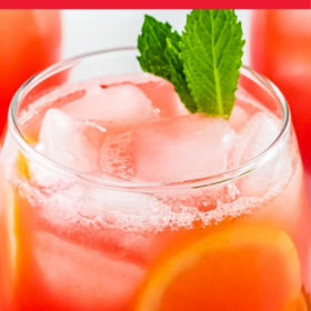 A glass of watermelon lemonade with mint garnish.
