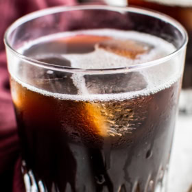 Up close image of a Carajillo in a glass.