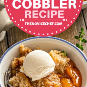 A bowl of peach cobbler with a spoon.