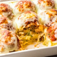 Up close image of meatball potato casserole with a serving removed so you can see the inside layers.
