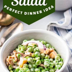 A bowl of creamy pea salad with bacon.