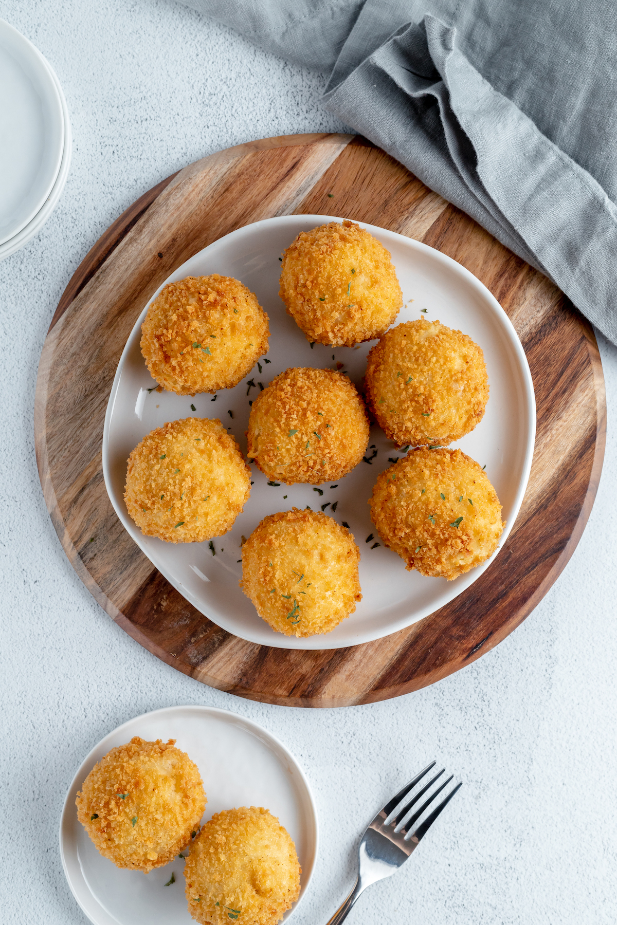 Overhead shot of fried papas rellenas on a plate.