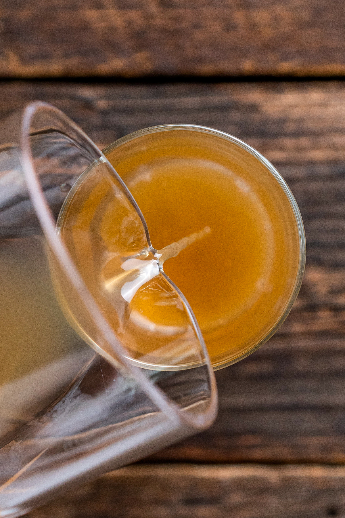 Pouring apple cider into a glass