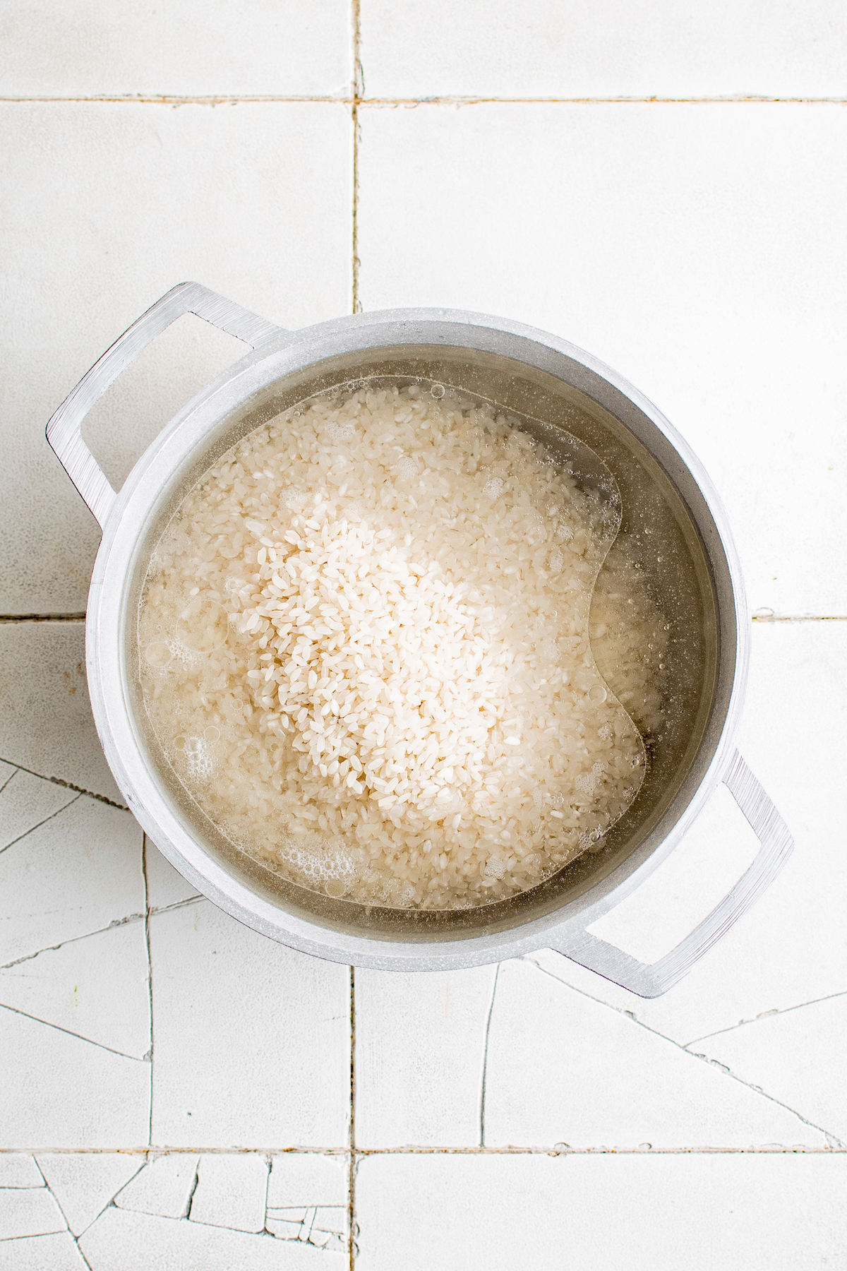 water and rice in a large cooking pot