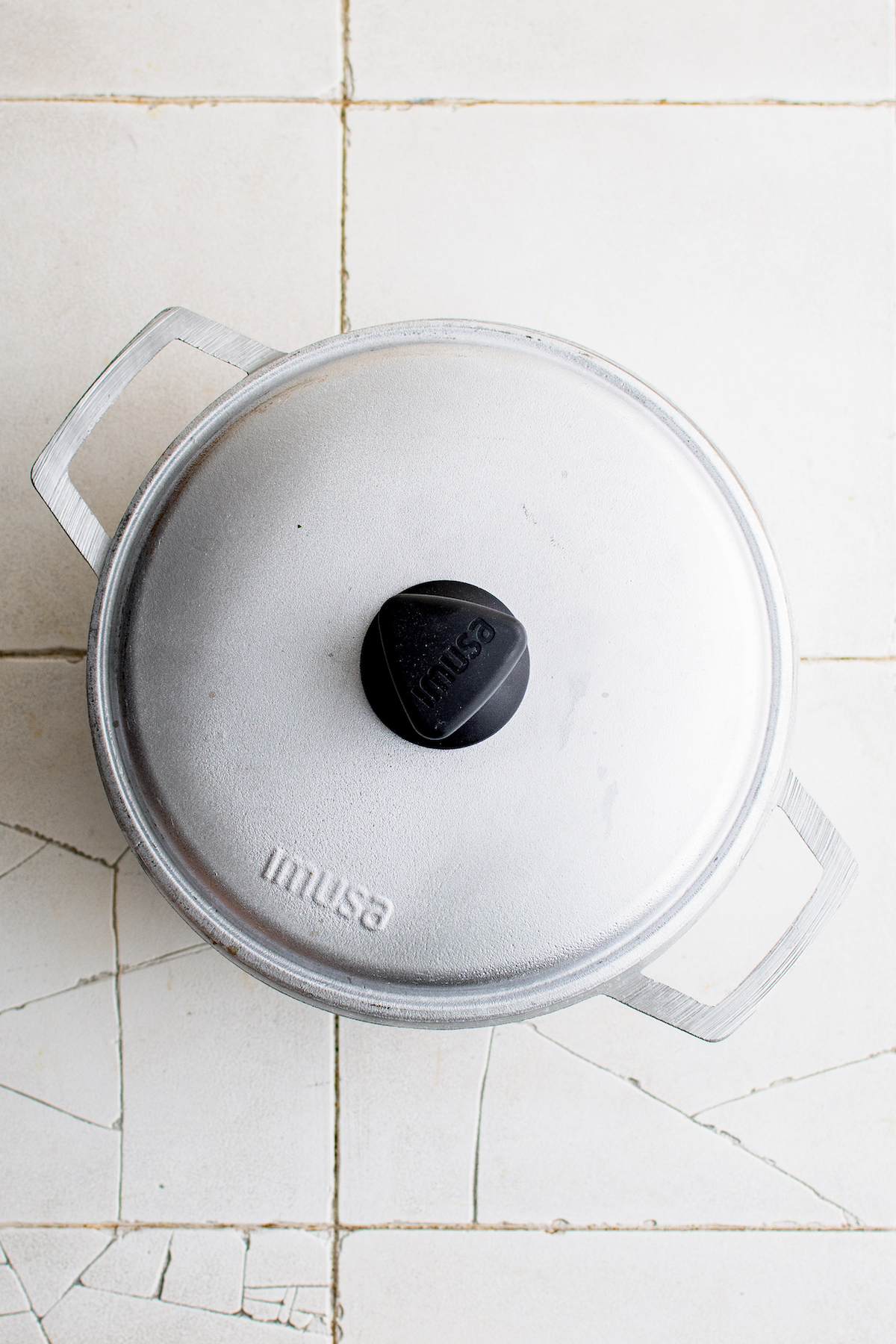 a cooking pot with lid on top
