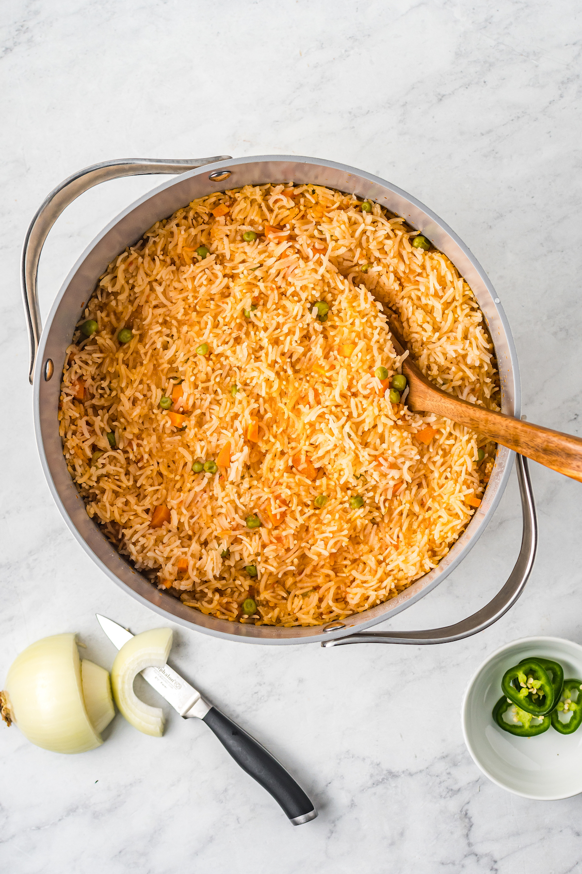 A large pot filled with Mexican rice.