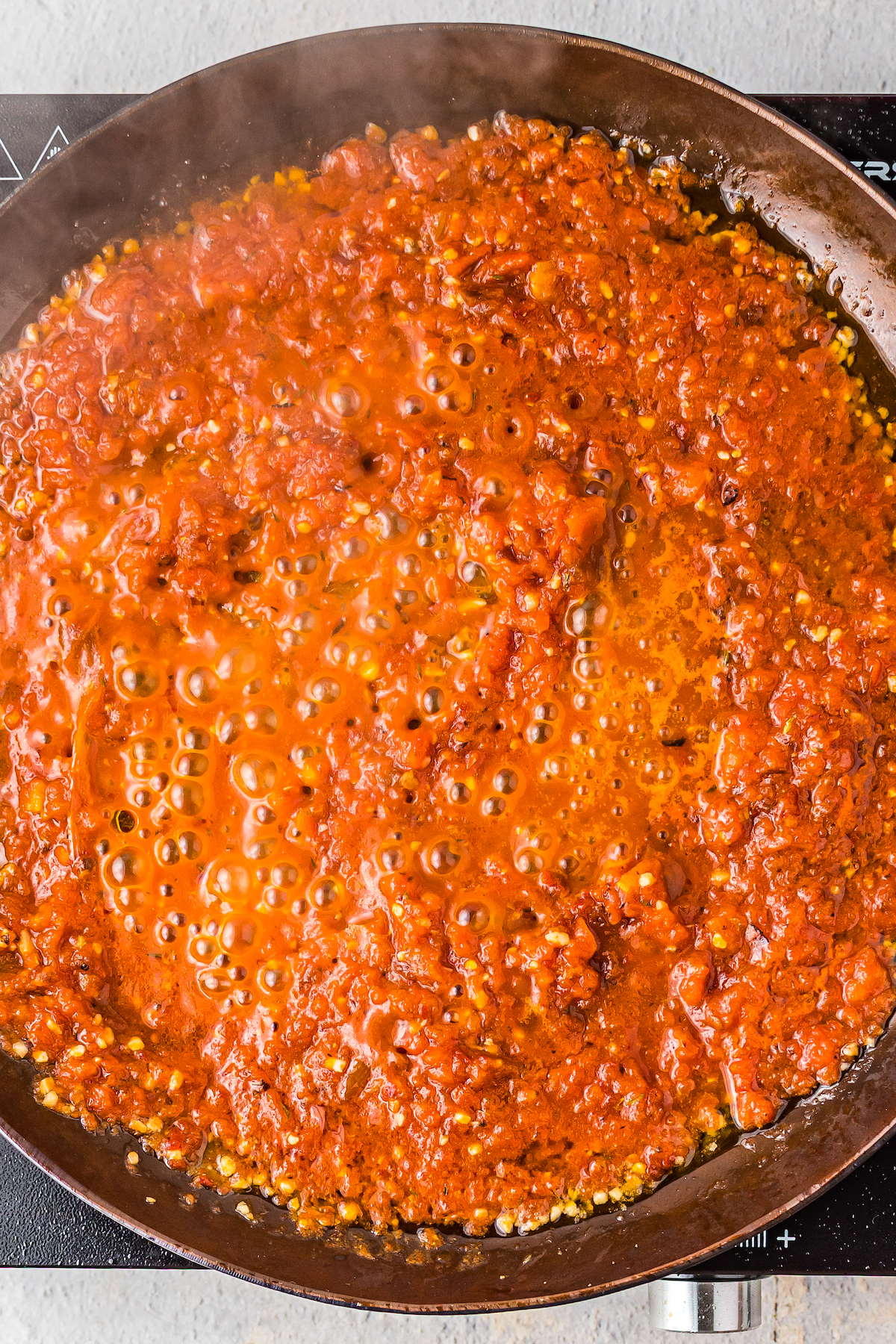 Chile sauce simmering in a skillet.