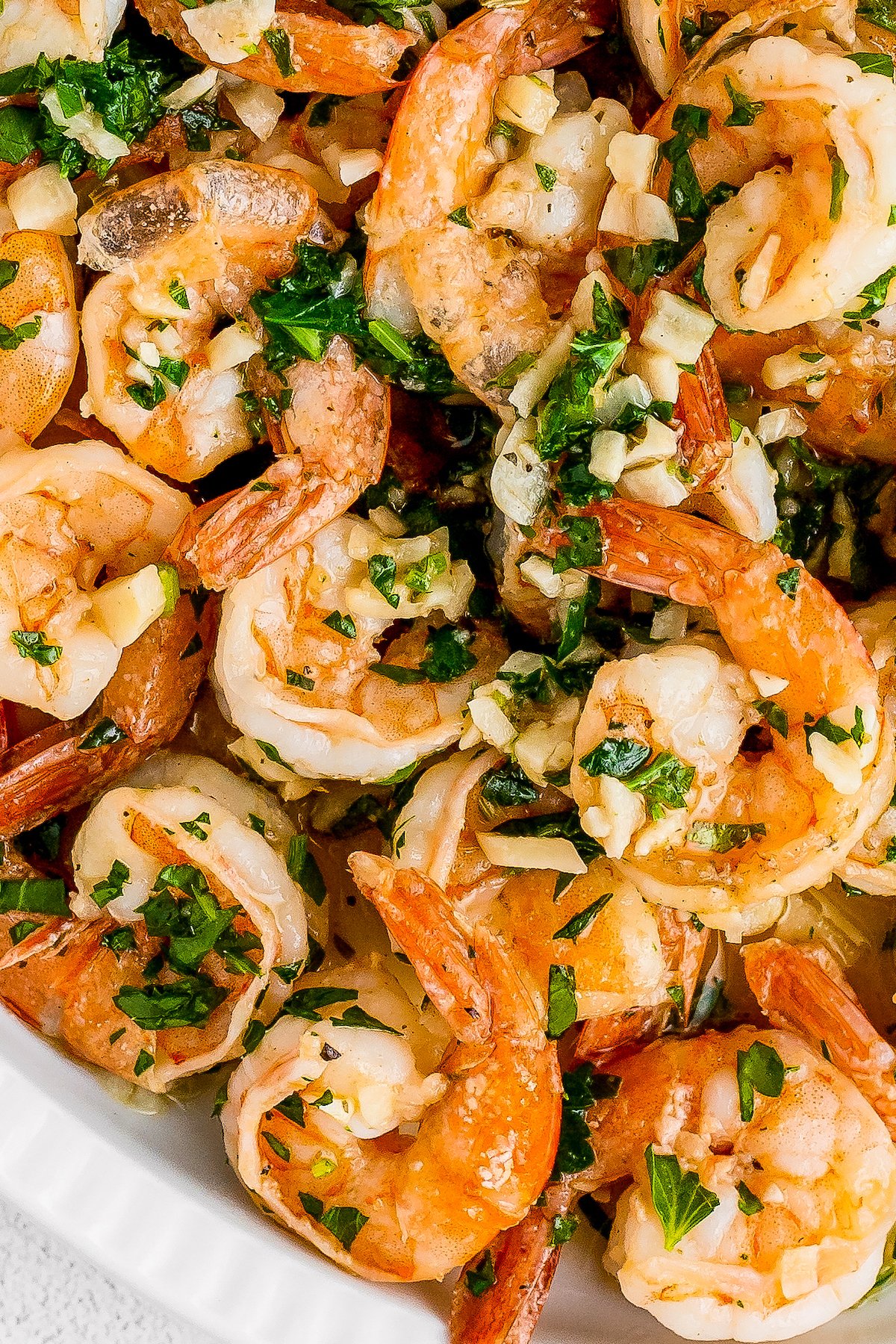 Close-up shot of camarones al ajillo (garlic shrimp).