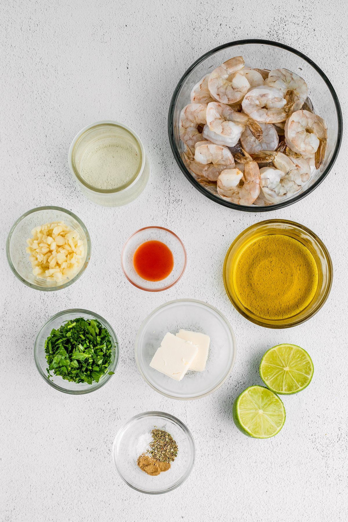 From top right: Raw shrimp, lime juice, garlic, hot sauce, olive oil, chopped parsley, butter, seasonings.