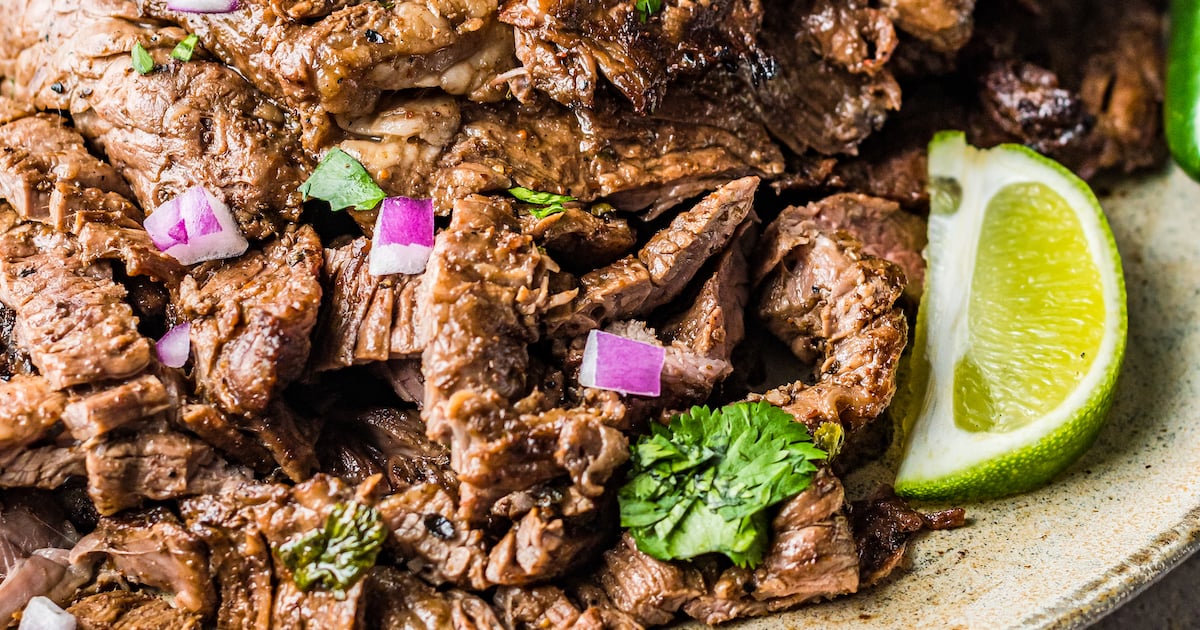 Close-up shot of grilled carne asada steak.