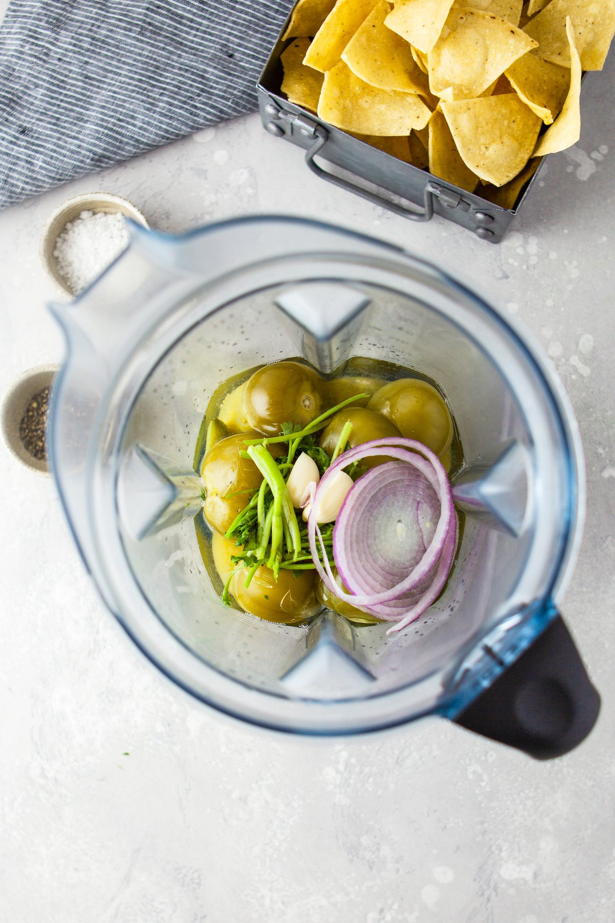 salsa verde ingredients in food processor about to be blended