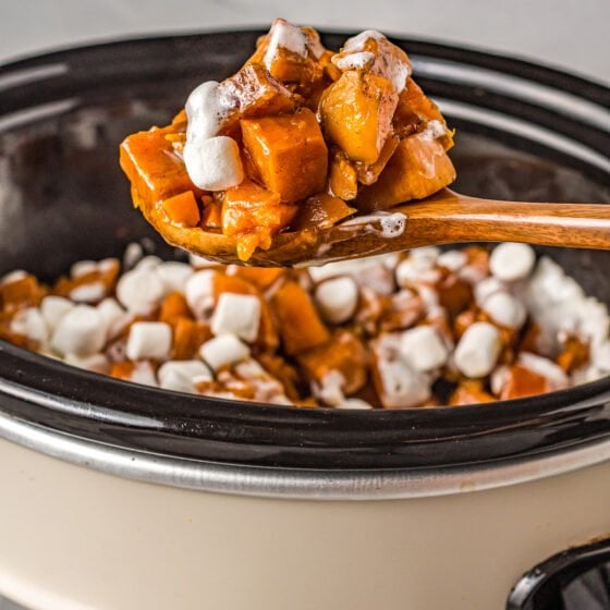 cubed sweet potatoes with melted mini marshmallows on top in a crockpot