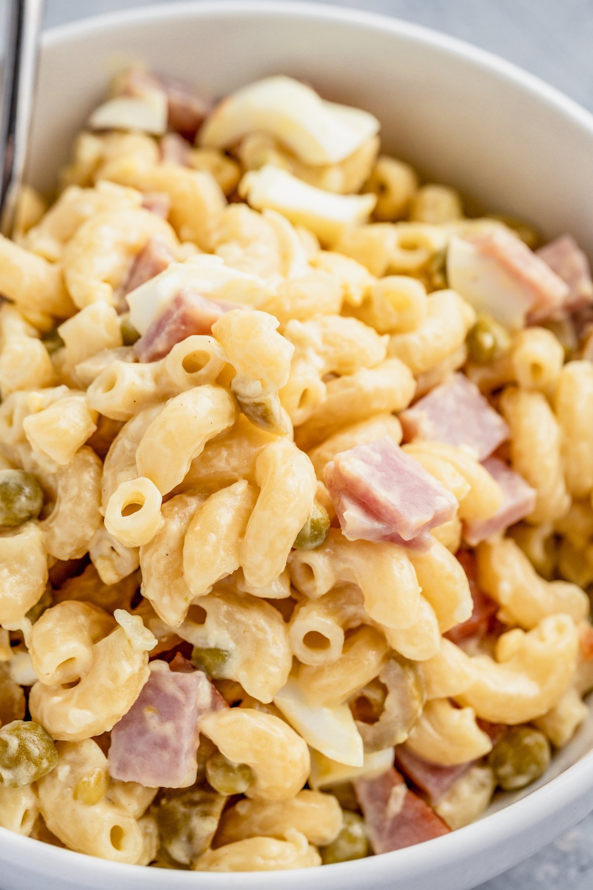 Pasta salad with ham, peas, and creamy dressing.