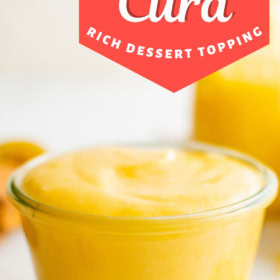 Lemon curd in a glass jar.