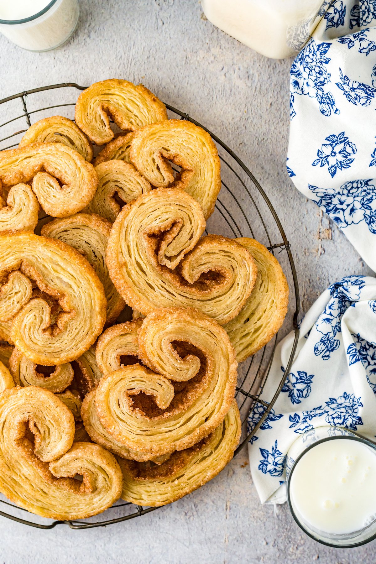 a plate of orejas, which are small pastry cookies that are golden brown and have curled edges