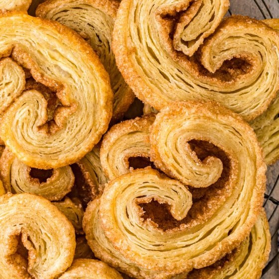 Small pastry cookies called Orejas (Palmiers), that are golden brown and have curled edges