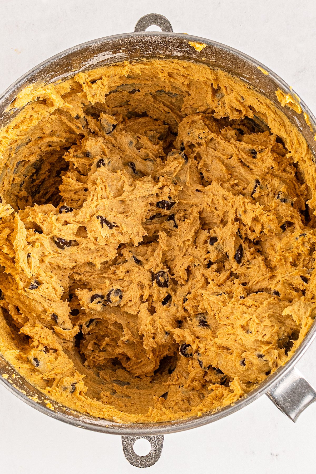 a mixing bowl with cookie dough