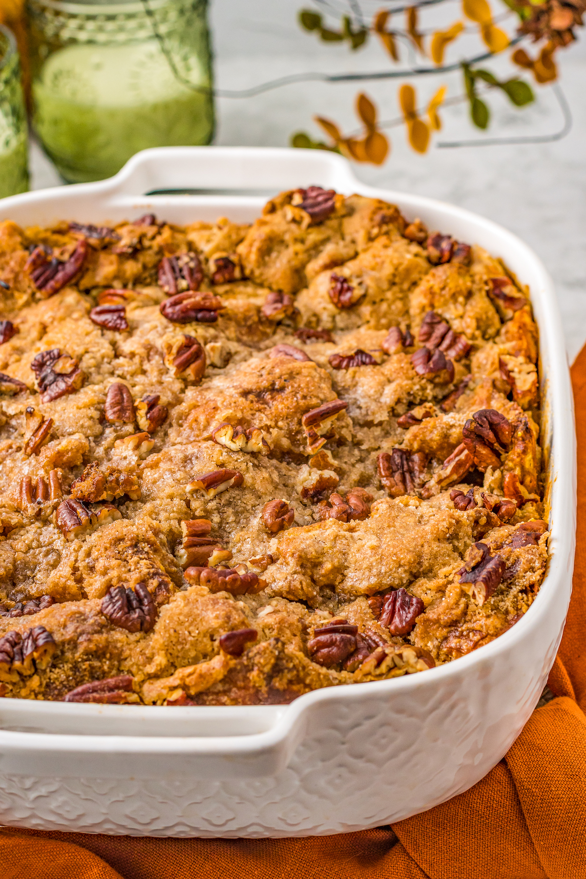 The toasty streusel topping of a pumpkin casserole studded with chopped pecans.