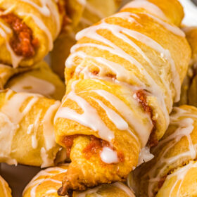 A crescent roll with crispy edges and stuffed with pumpkin filling.