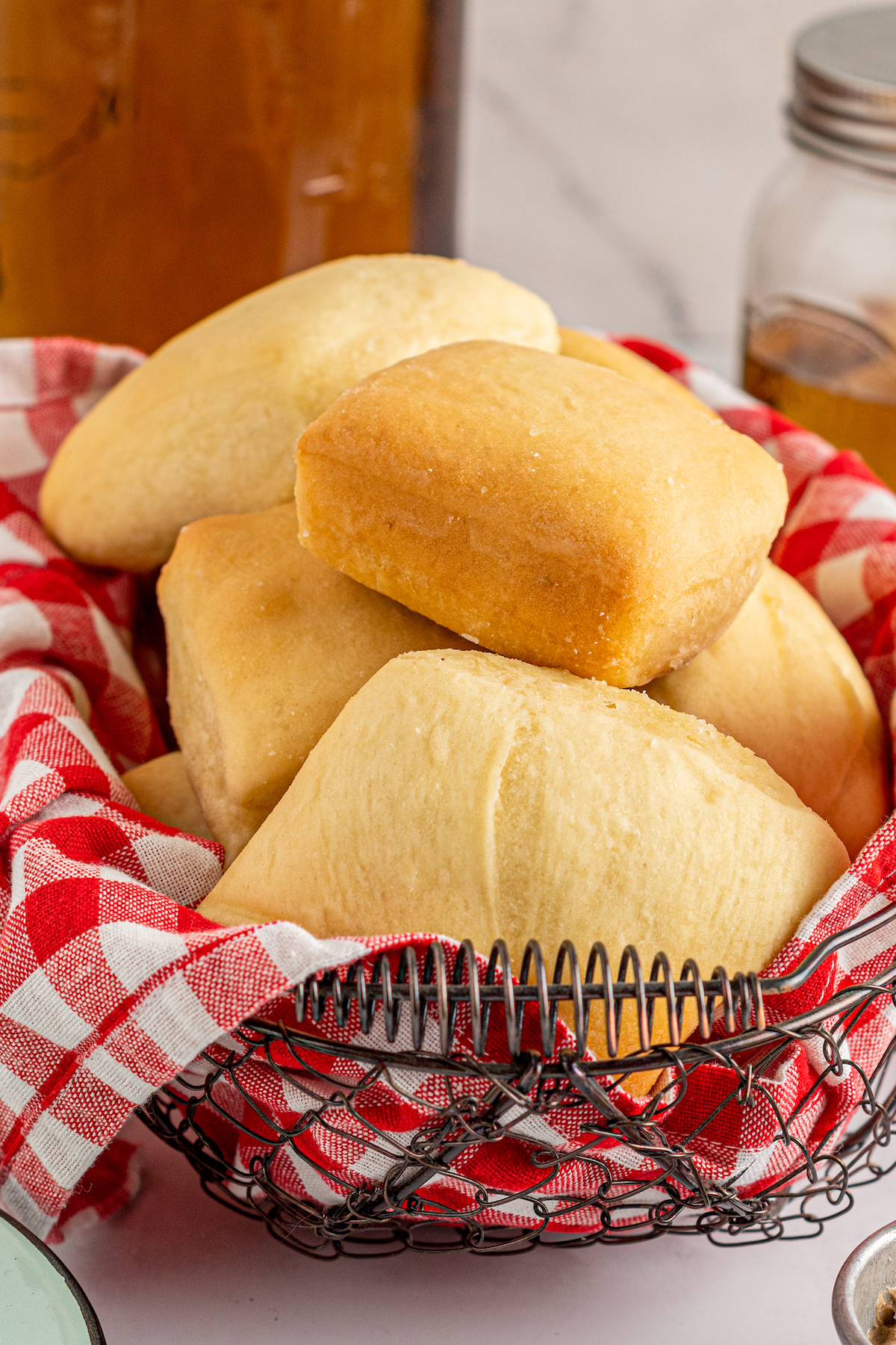 A basket of square yeast rolls.