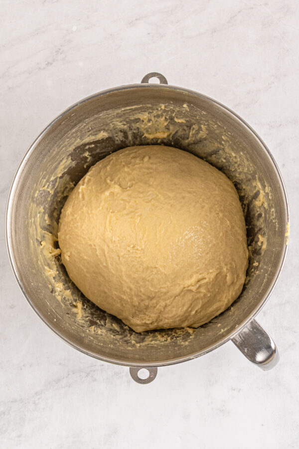 Yeast rolls dough in a mixing bowl.