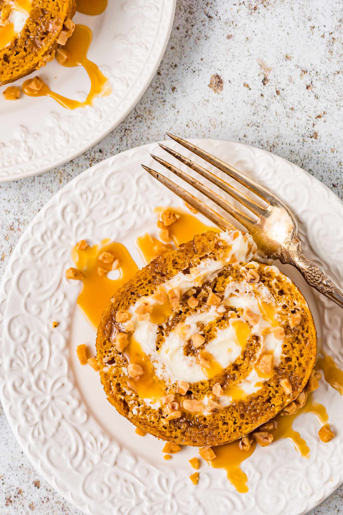 Close-up shot of pumpkin roll on a plate.