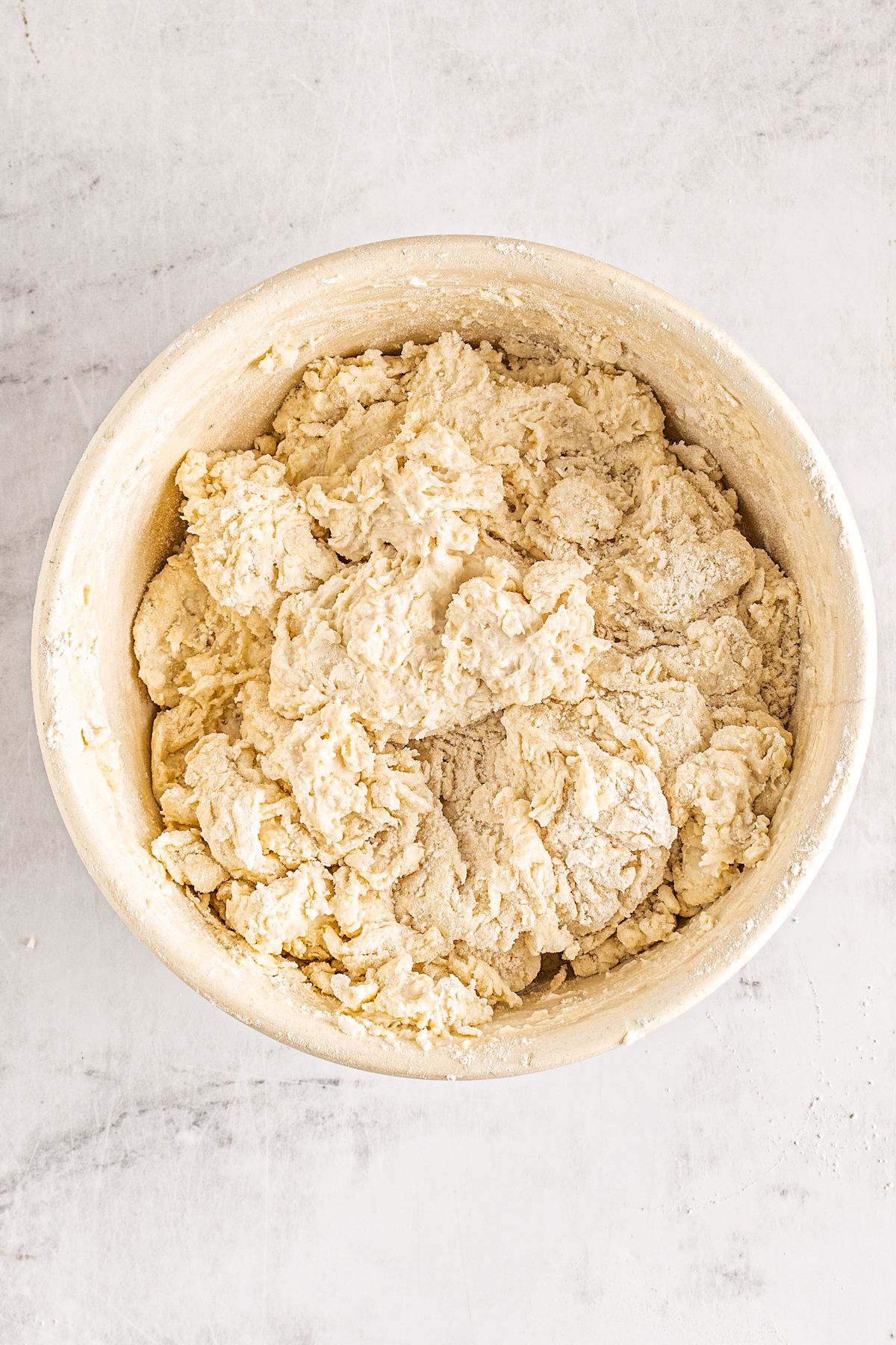 Biscuit dough in a mixing bowl.