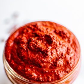 A mason jar filled with achiote paste.