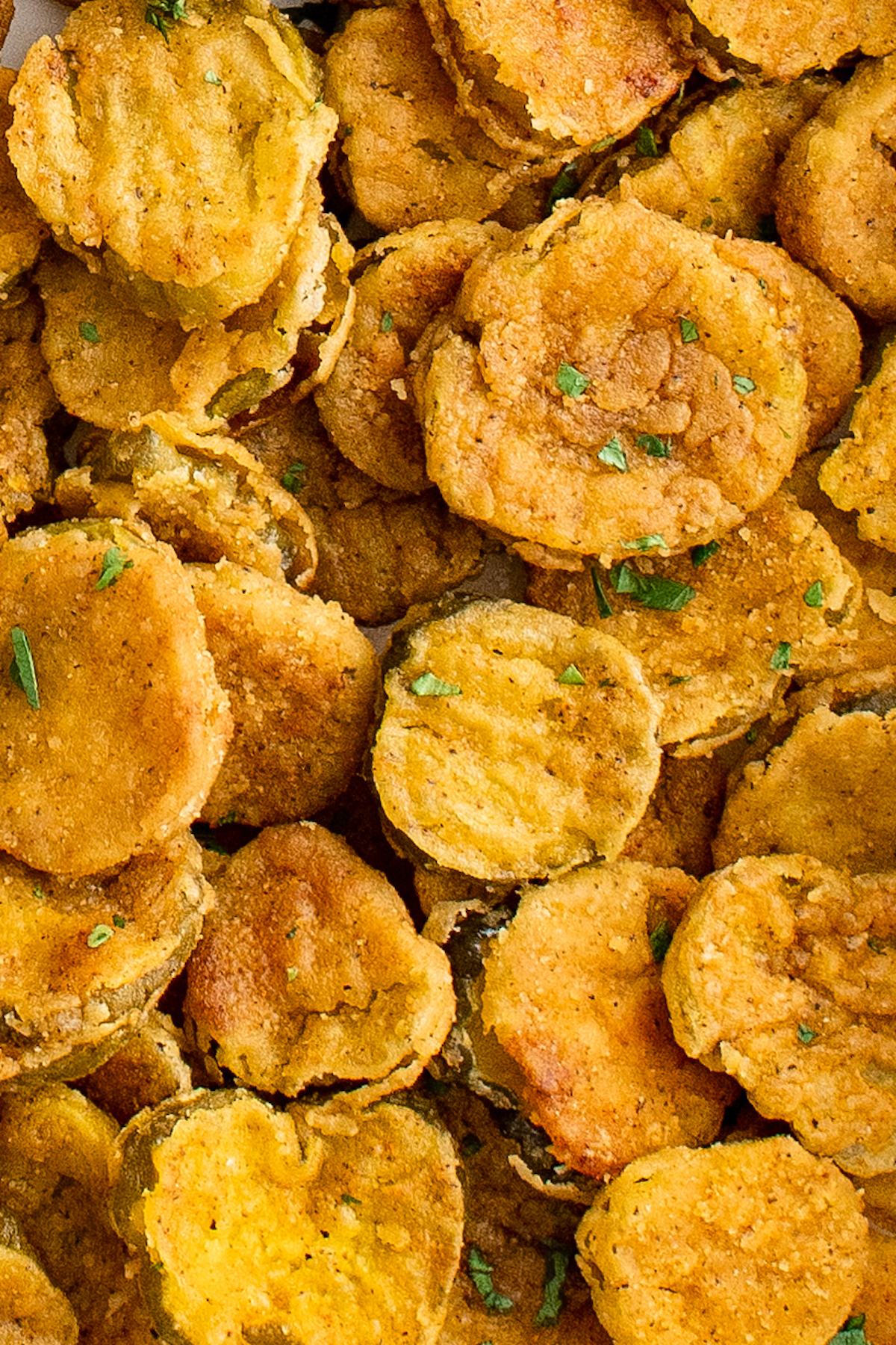 Close-up shot of breaded fried pickles.